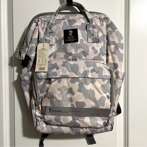 Shiada brand diaper bag backpack with a camouflage pattern in grey, pink, &white